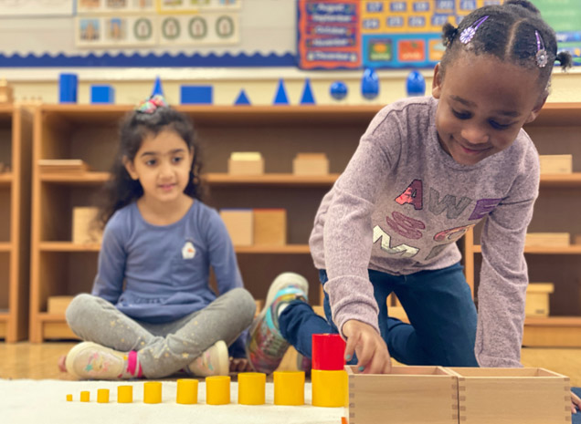 Montessori School of San Leandro teacher working with a preschool/kindergarten child