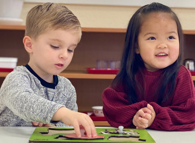 Montessori School of San Leandro teacher working with two-year old toddler program